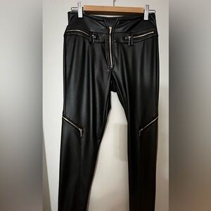 Black pants with zippers. Brand new. Great feel and look.